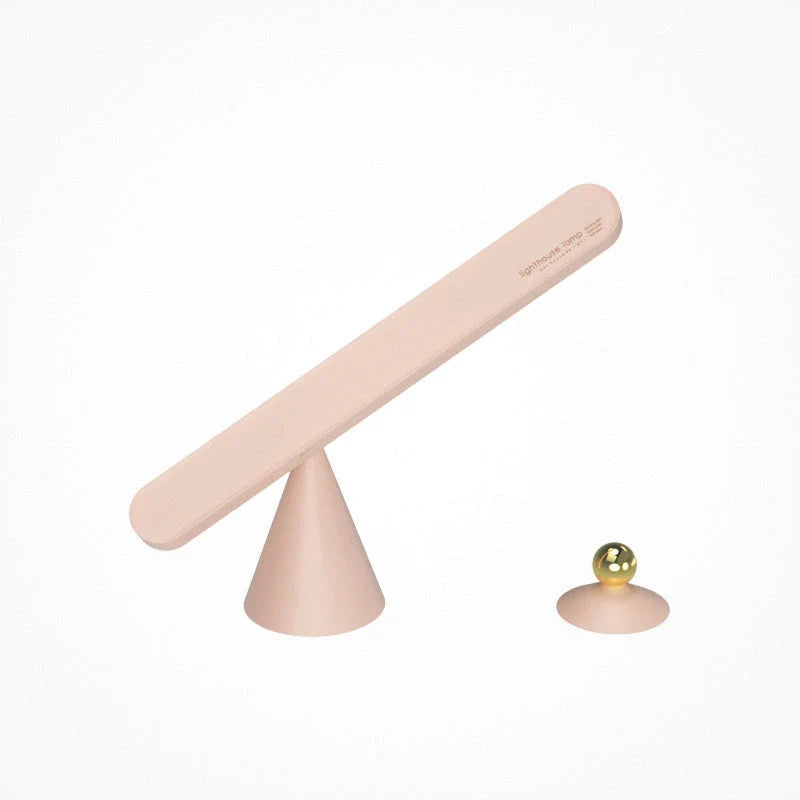 A modern, geometric desk lamp with wireless charging and a magnetic suction base for easy placement