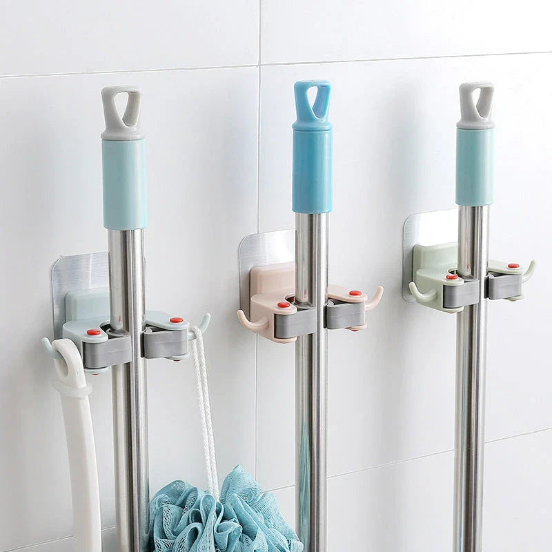 Versatile adhesive wall hooks for organizing mops, brooms, and other cleaning tools in the bathroom or laundry room