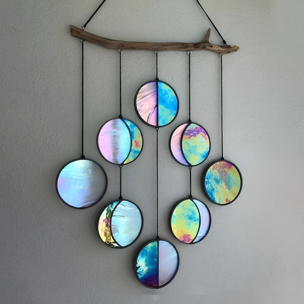 Rainbow coloured moon phase wall decoration with circular iron framework and hanging chain