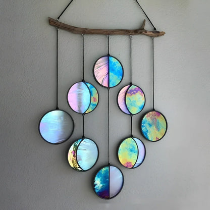 Rainbow coloured moon phase wall decoration with circular iron framework and hanging chain