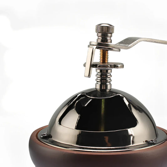 Manual coffee grinder with solid wood barrel and ceramic burrs for precise grinding control