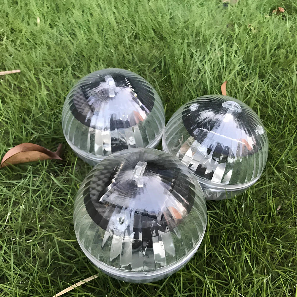 Solar-powered floating pool lights with colour-changing LEDs on water surface