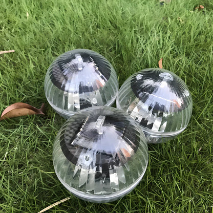 Solar-powered floating pool lights with colour-changing LEDs on water surface