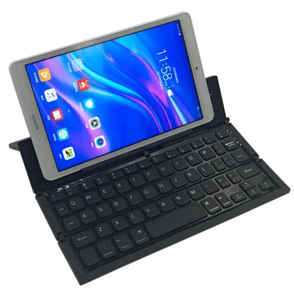 Black folding Bluetooth keyboard for tablets showing compact 5.8-inch size with wrist support extended