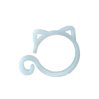 Red cat-shaped plastic gardening clip securing plant stem, showing 3cm length and decorative feline design