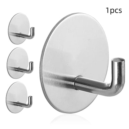 Two round stainless steel self-adhesive hooks, one black and one polished, for no-drill bathroom and kitchen hanging.