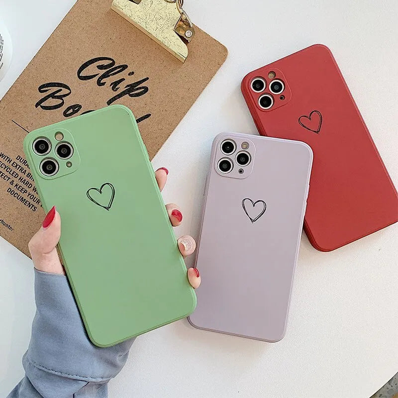 Silicone iPhone case in solid colours like black, green, pink, and white, showing TPU material and slim back cover design