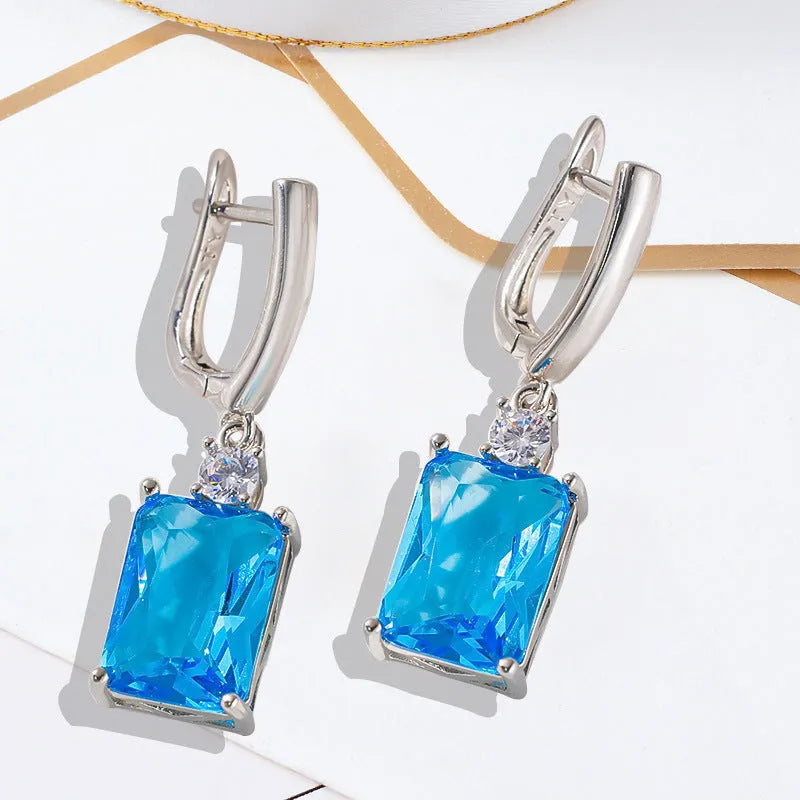 Square geometric copper earrings with electroplated gold or silver finish and quadrilateral design