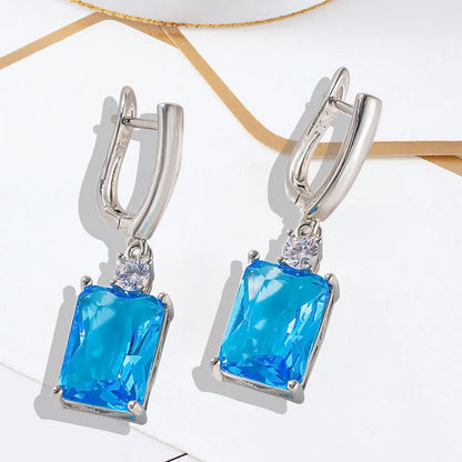 Square geometric copper earrings with electroplated gold or silver finish and quadrilateral design