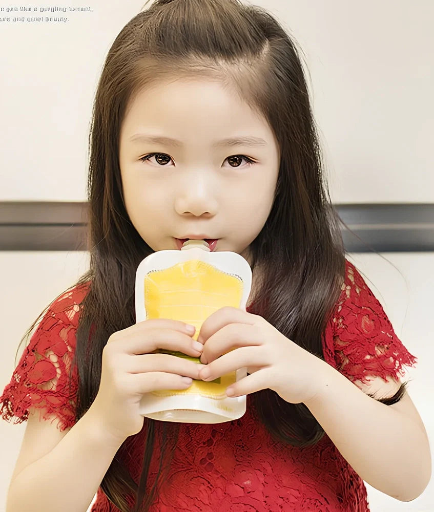 Baby food squeeze station pressing puree into 4-ounce pouch with ABS construction measuring 18x9x22cm