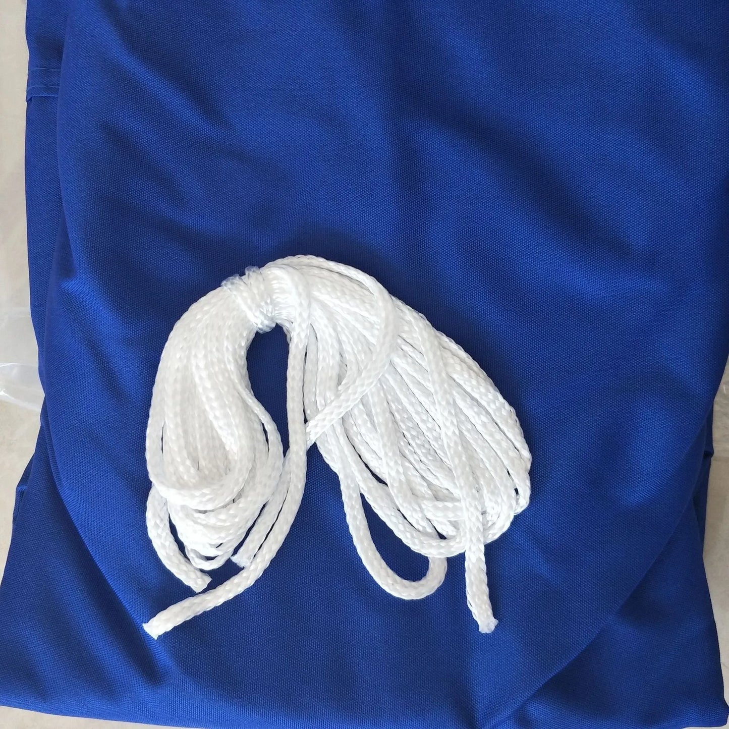 Blue curved square UV protection shade sail measuring 3m by 4m