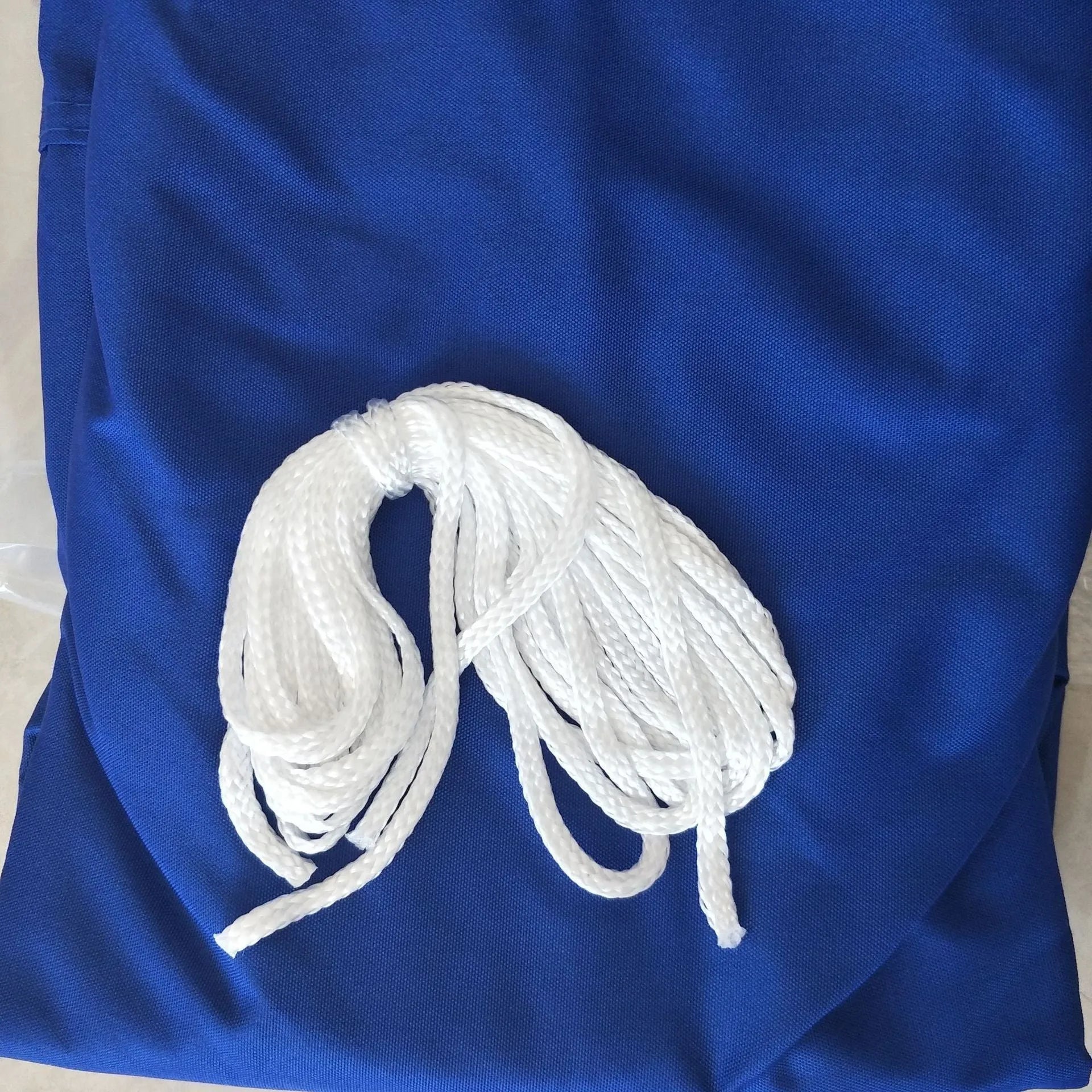 Blue curved square UV protection shade sail measuring 3m by 4m