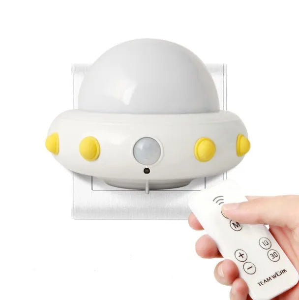 Remote control UFO bedside night light in blue, pink, or white colours with compact 105mm x 76mm dimensions
