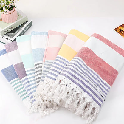 Striped Turkish beach towel showing blue and white pattern, measuring 100cm by 180cm