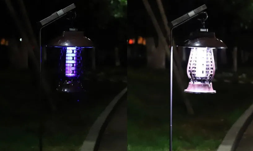 White and black solar-powered electronic mosquito lamp for garden outdoor insect control.