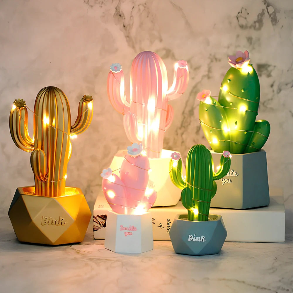 Cactus-shaped resin night light in gold finish measuring 15cm tall with warm LED glow