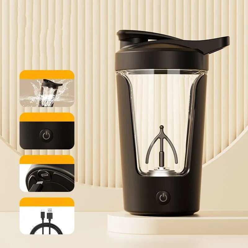 Black electric protein shaker bottle with lid and USB charging cable on a table
