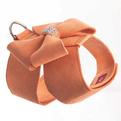 Puppy wearing a pink microfiber chest strap with a bowknot, adjustable in sizes S, M, L, XL
