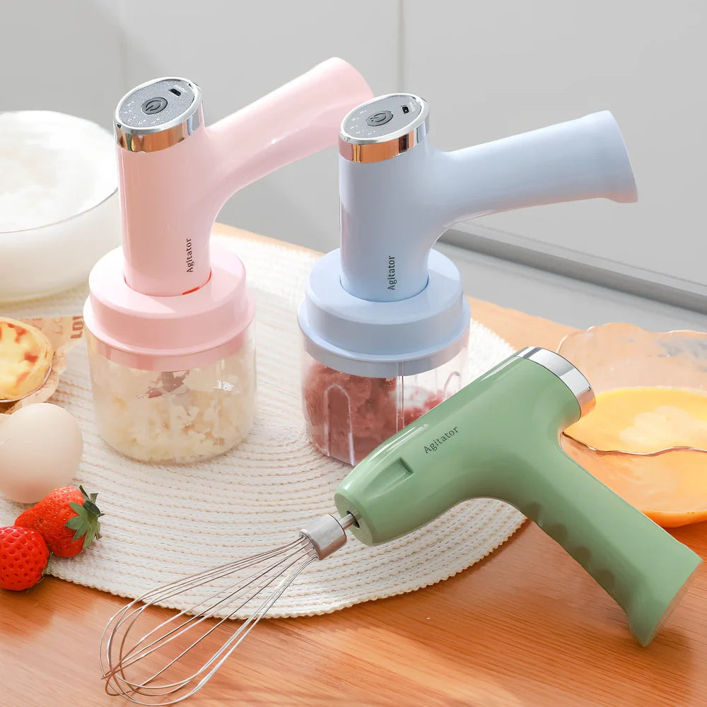 Pink electric whisk with stainless steel beaters showing 5-speed dial and compact 12cm housing