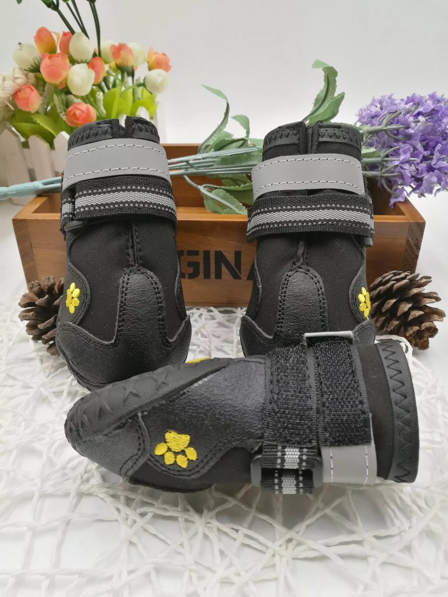 Black waterproof dog shoes with non-slip soles and adjustable fuzzy belts