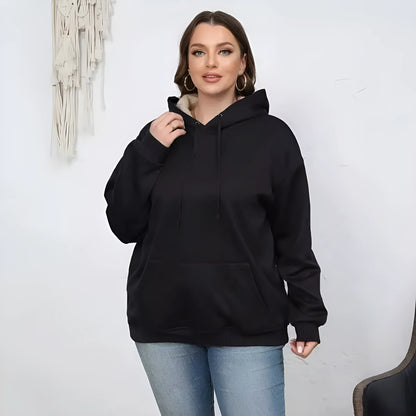 Women's loose fit hooded sweater in thick grey polyester fleece with 3D pattern and front pockets.