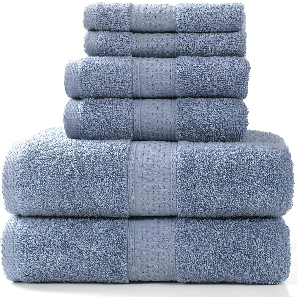 Cotton towel set showing bath towel, hand towel, and face cloth in coordinated sizes