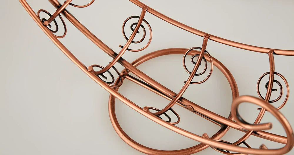 Stainless steel wine rack measuring 320mm wide with wine bottle storage