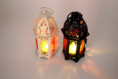 Wrought iron candle holder with 16cm height and 7cm diameter in black finish showing hanging design