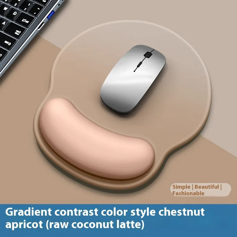 Silicone mouse mat with wristband in a gradient blue black colour pattern on a desk.