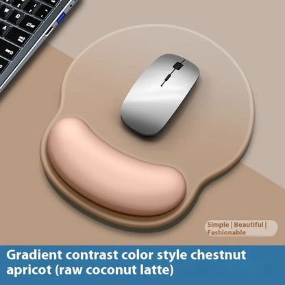 Silicone mouse mat with wristband in a gradient blue black colour pattern on a desk.