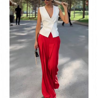 Beige women's two-piece set with sleeveless V-neck top and high-waist wide-leg trousers on a hanger.