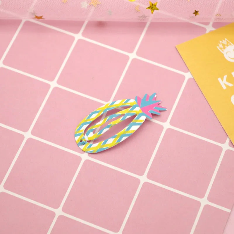 Colourful metal hair barrettes for children with printed watermelon, strawberry, pineapple and Christmas designs.
