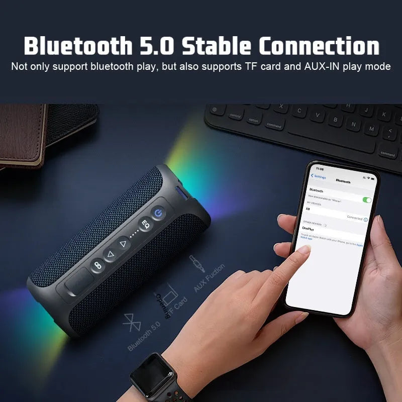 Black and blue fabric Bluetooth speaker with lighting effects, measuring 20cm width with waterproof construction