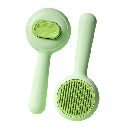 Cat grooming brush with stainless steel teeth and non-slip handle in green or yellow colour options