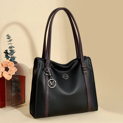 A soft PU leather women's crossbody bag in a retro style with double shoulder straps, shown in a choice of colours.