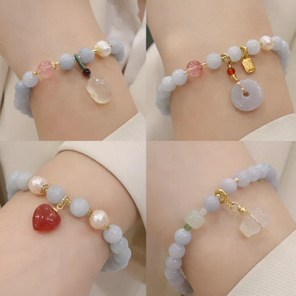 Gold plated women's bracelet with artificial crystal aquamarine chalcedony pendant in climbing cat design