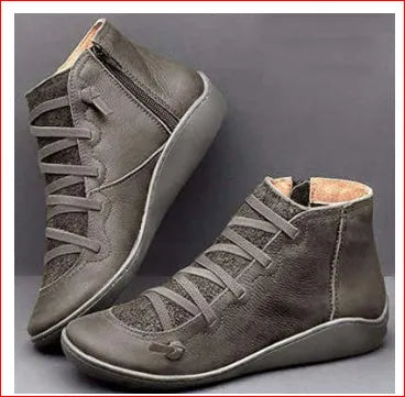 Women's casual booties with wedge heel and round toe in various colours like black and leopard print, showing rubber sole.