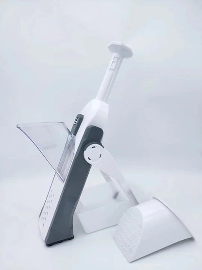 White and blue multifunctional vegetable slicer with stainless steel blades on a kitchen counter.