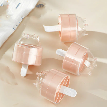 Four colourful lollipop-shaped silicone ice moulds showing creamy yellow, pink, blue, and yellow options