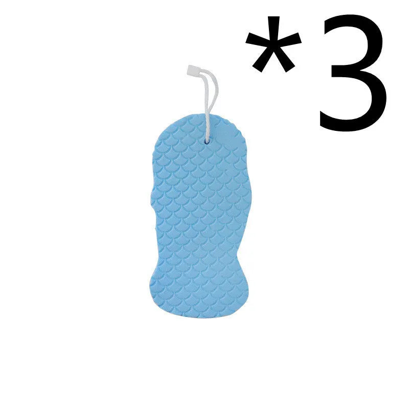 White 3D bath ball sponge with a fish scale exfoliating texture on a blue background.