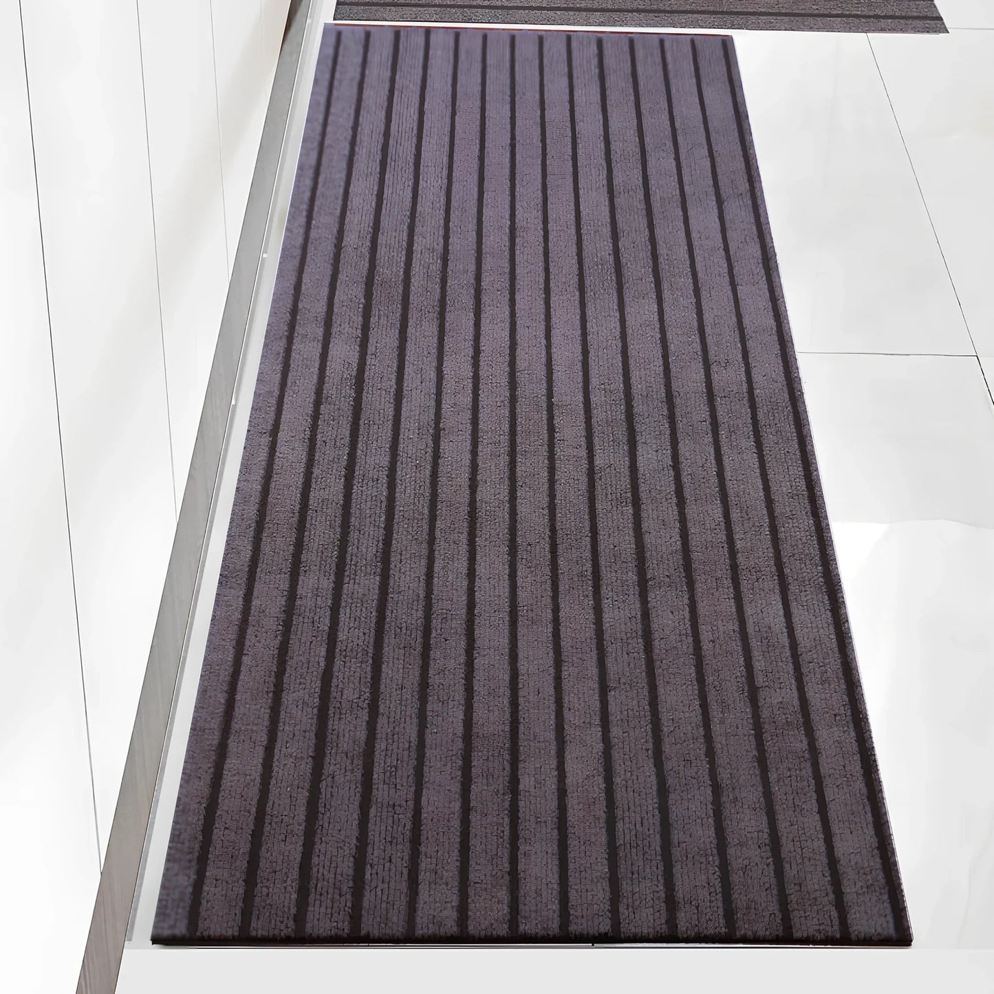 PVC kitchen floor mat with seven-stripe design in camel colour showing machine-woven texture
