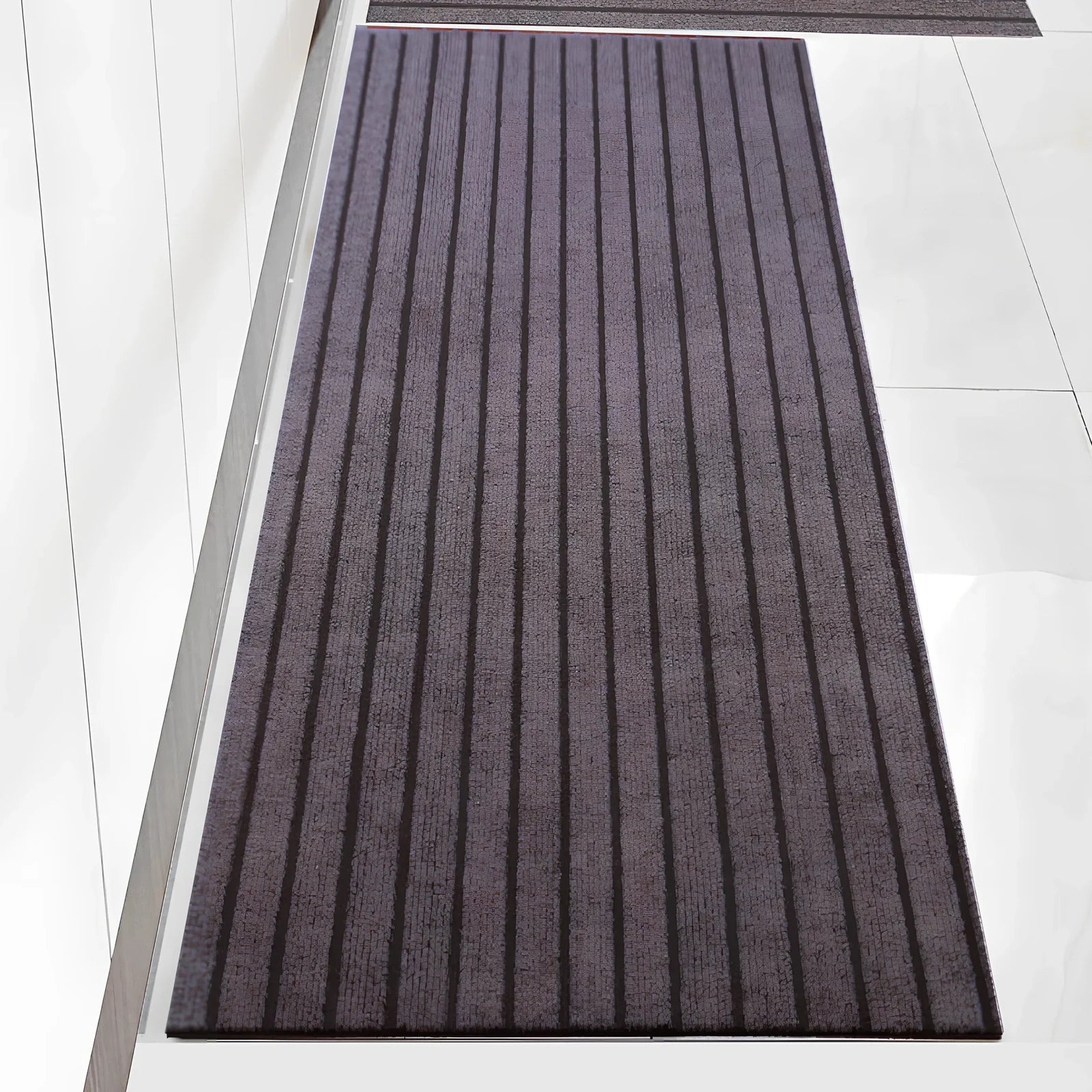 PVC kitchen floor mat with seven-stripe design in camel colour showing machine-woven texture