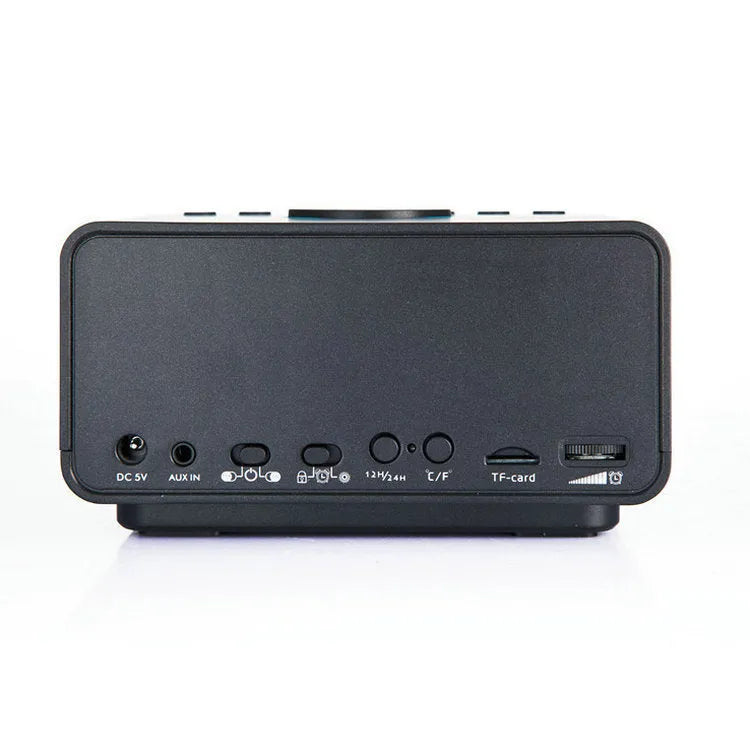 Black wireless alarm clock speaker with dual speakers, display, and control buttons