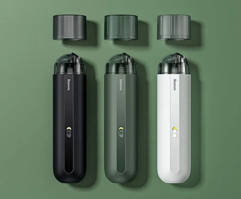 BASEUS handheld car vacuum cleaner in black with blowing hose attachment, showing compact size and dust bin