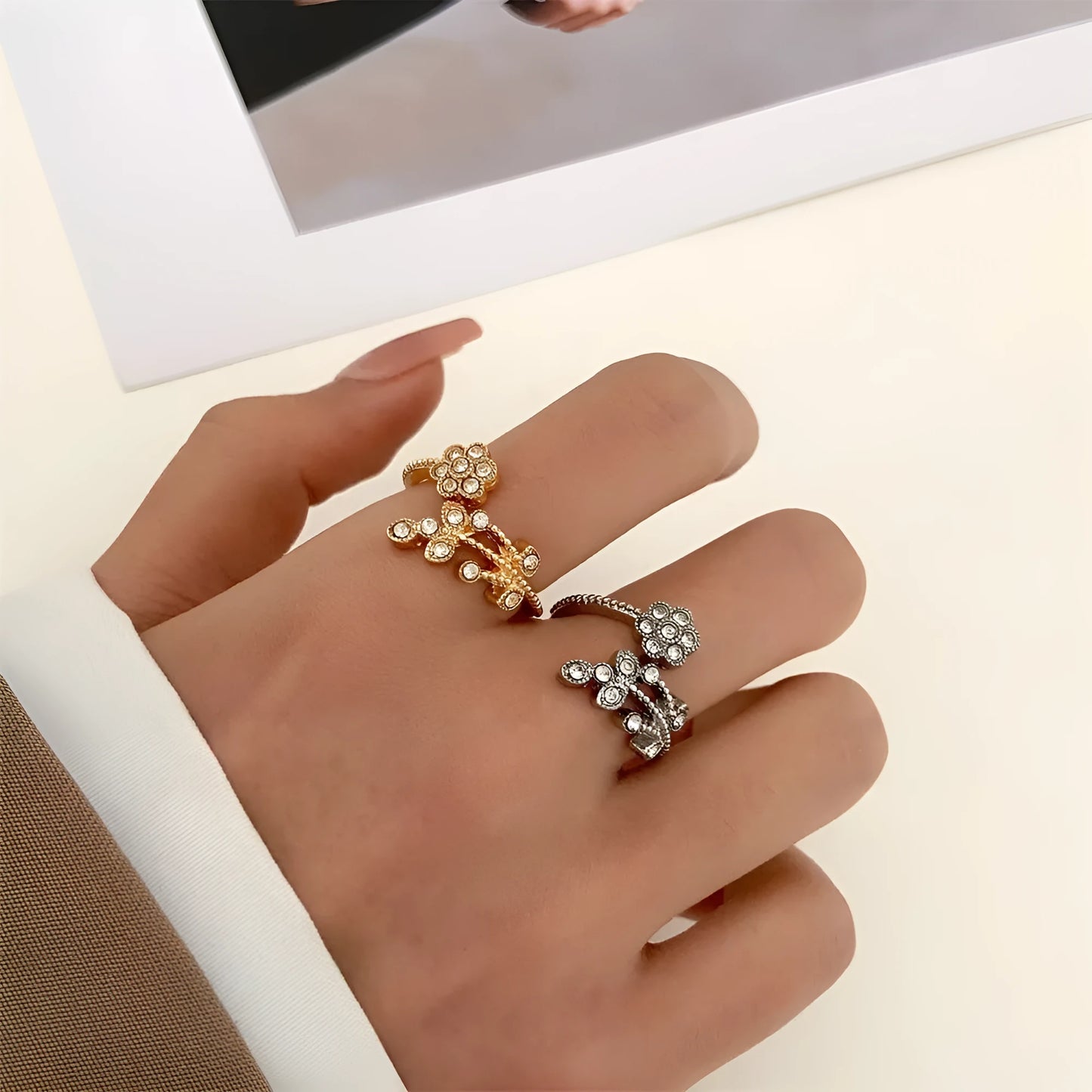 Women's copper open ring with diamond-treated flower and leaf design in gold colour.