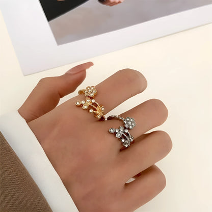 Women's copper open ring with diamond-treated flower and leaf design in gold colour.