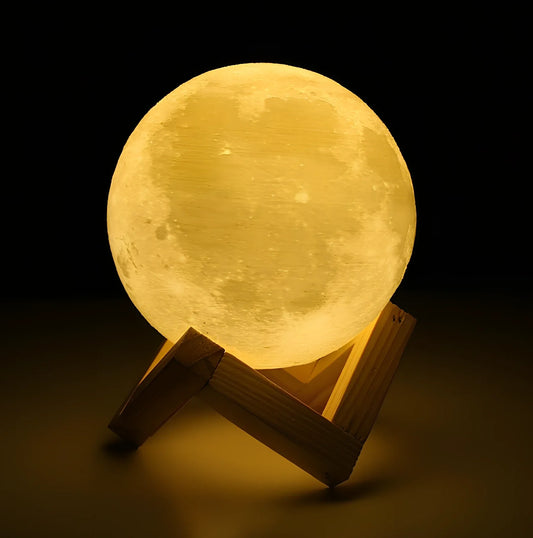 3D printed moon night light with detailed lunar surface and dual-colour LED lighting on beech wood stand
