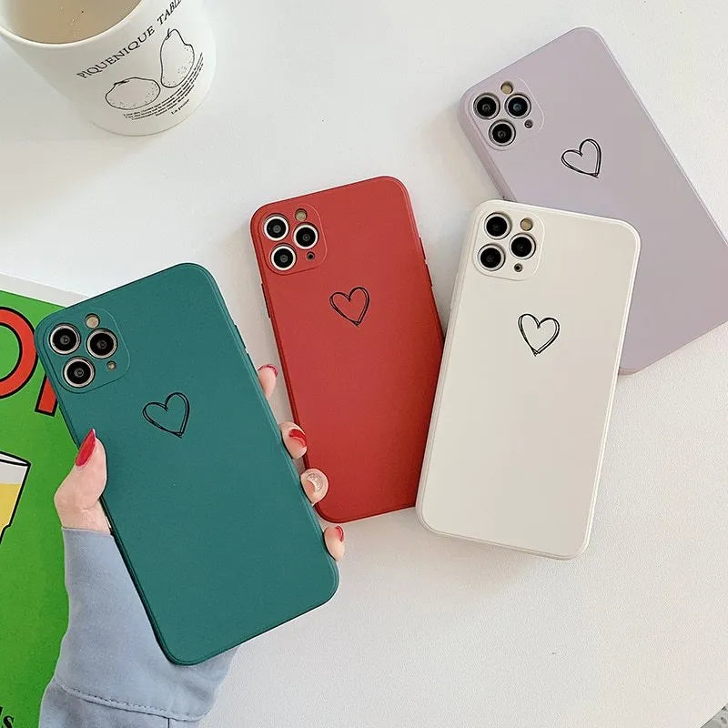 Silicone iPhone case in solid colours like black, green, pink, and white, showing TPU material and slim back cover design