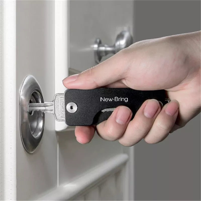 Metal Multifunctional Keychain Organizer in various colors, holding multiple keys