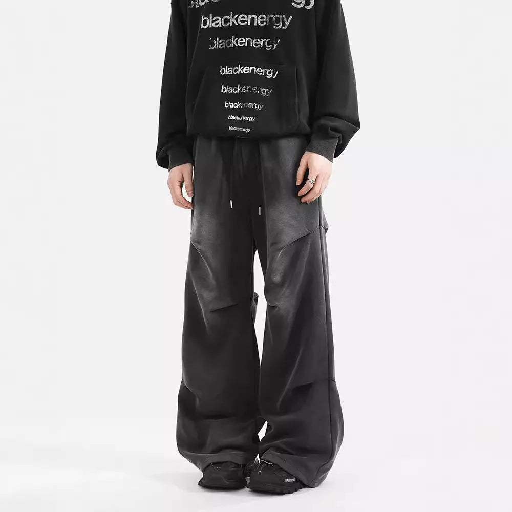 Men's cotton straight-leg sweatpants in black and gray with pleated washed finish and elastic waist